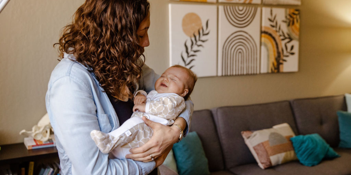 A new mom soothes her newborn baby. Perspective can help her stay regulated.